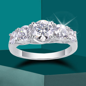 Women's S925 Moissanite Round Channel Shoulders Ring. - Different Drips