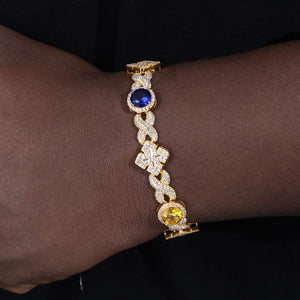 Infinity-Link Bracelet with Canary & Sapphire-Blue Rounds, Cross Center - Different Drips