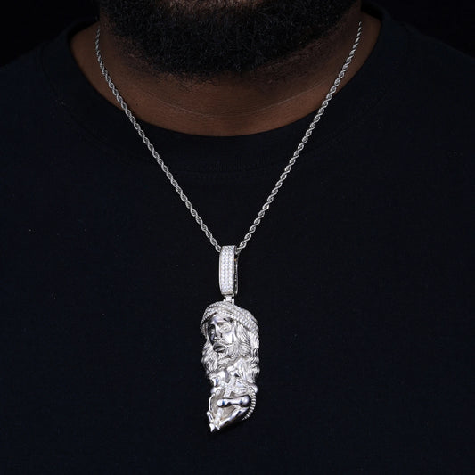 Jesus holding cross pendant over sterling silver with moissanite stones