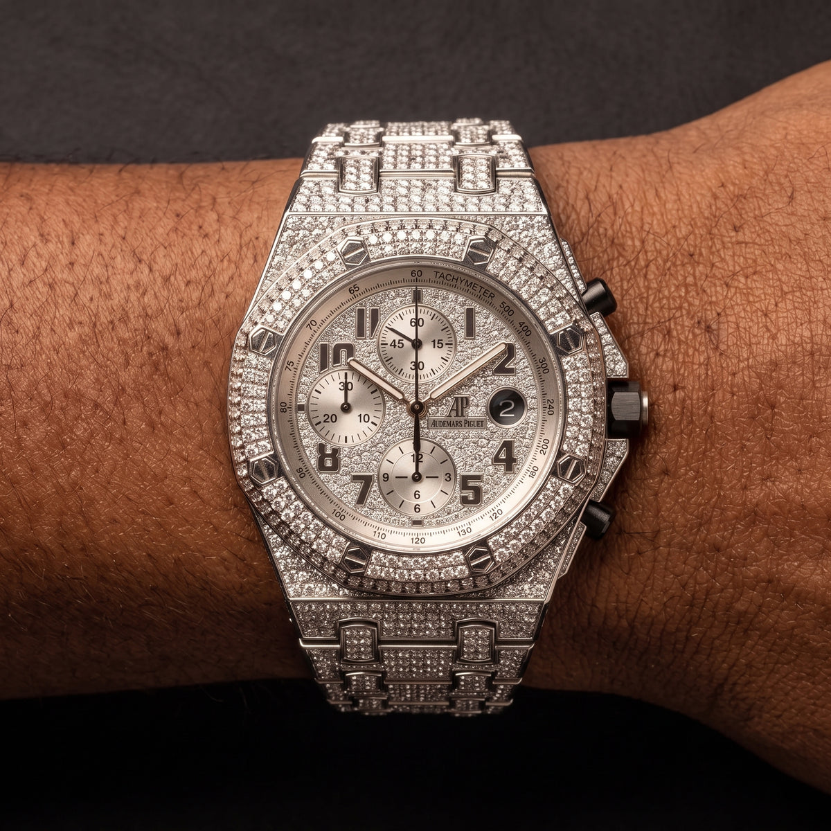 Iced octagonal chronograph watch with screw head bezel and stone-set case