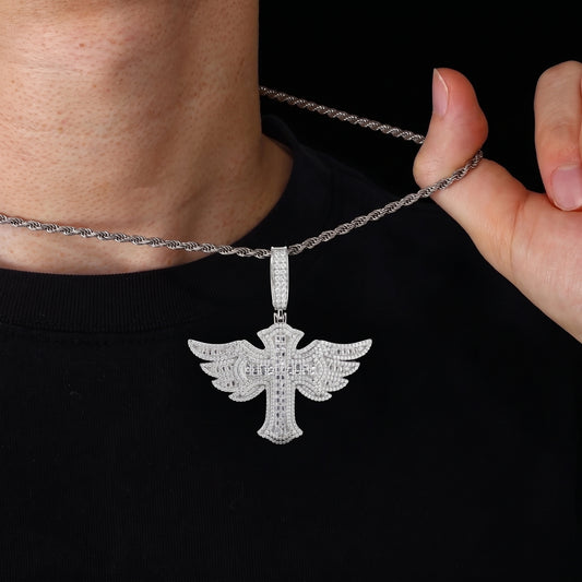 Winged cross pendant with baguette cut stones and pavé angel wings over sterling silver