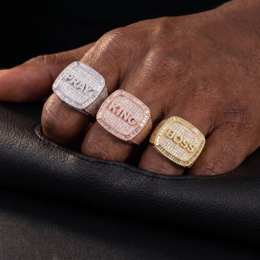 Custom letter championship ring with iced initials and prong-set stones