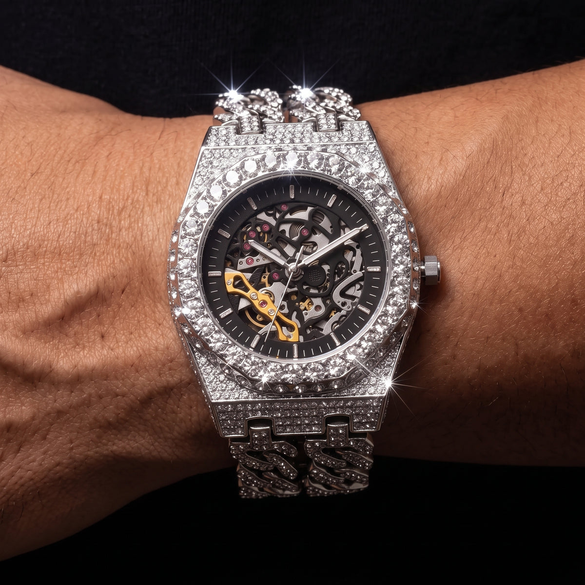 Iced out skeleton watch with visible movement and Cuban link band