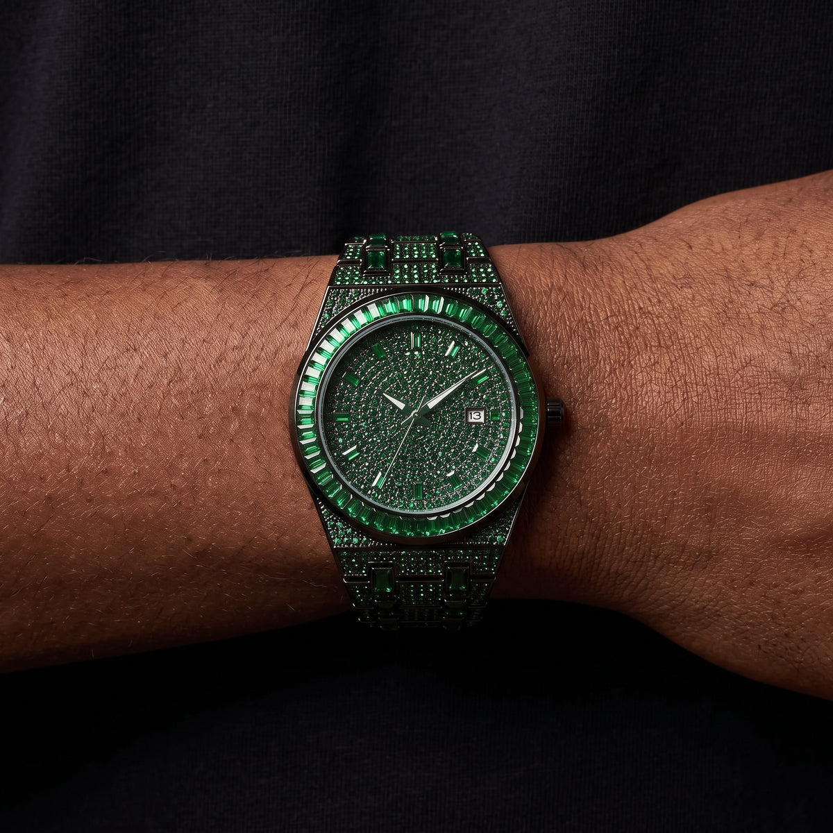 Bust down watch with green baguette stones and angular bezel
