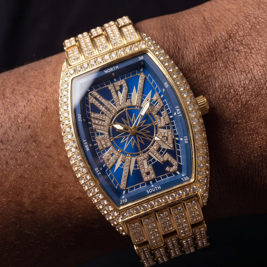Iced tonneau shaped watch with blue compass dial