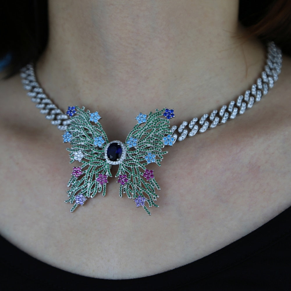 Women's Iced Out Hollow Butterfly Pendant - Different Drips